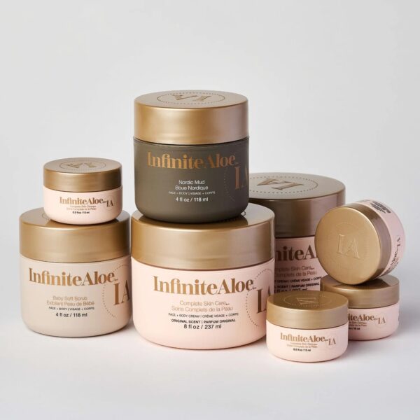 The Everyday Hero Jar Collection - Original by InfiniteAloe features neatly arranged beige, gold, and gray jars of varying sizes, including creams, scrubs, and masks with clear labels on a white background.