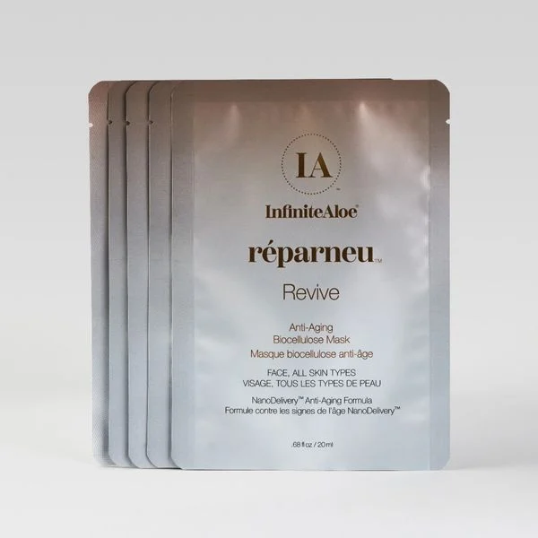 Five silver packets from the Revive Mask 5-Pack are fanned out, showing the front packet with product details in English and French and a minimalist design.